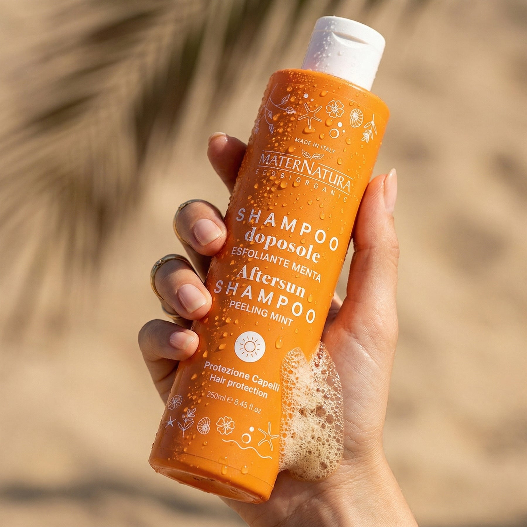Reparative shampoo hair in the sun with pomegranate flowers