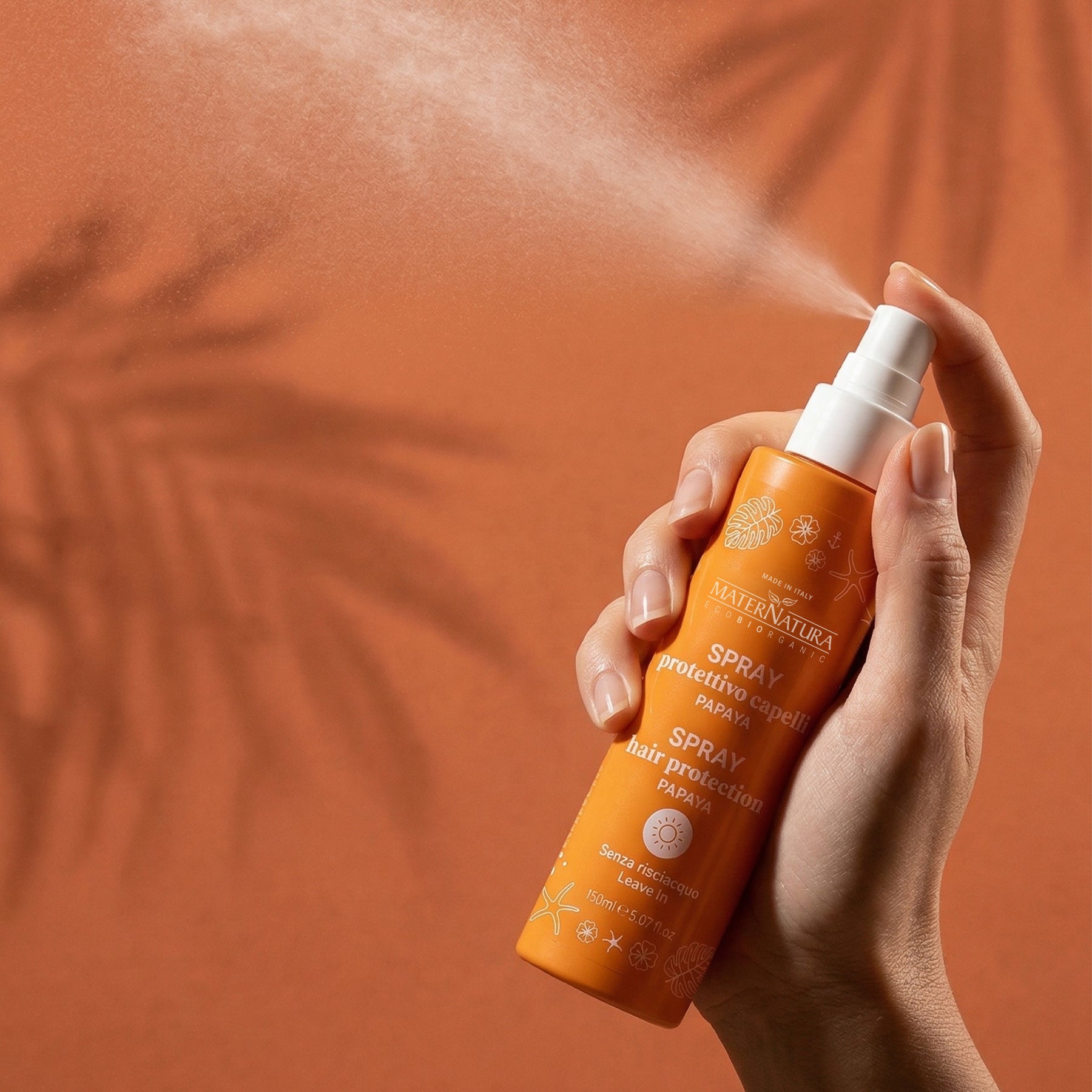 Repairing hair spray with mango and papaya sun