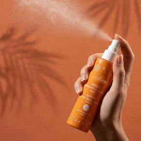 Repairing hair spray with mango and papaya sun